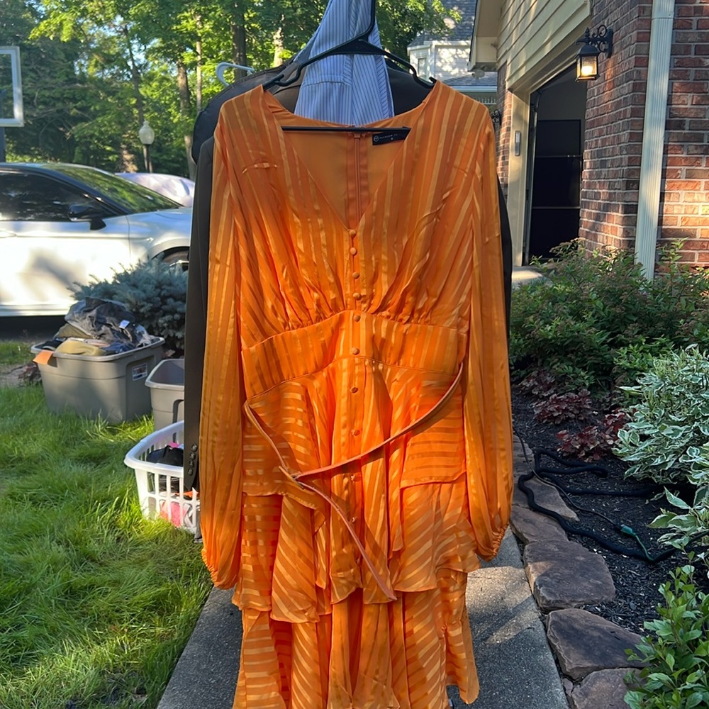 Beautiful satiny flowy dress for church or special occasions.